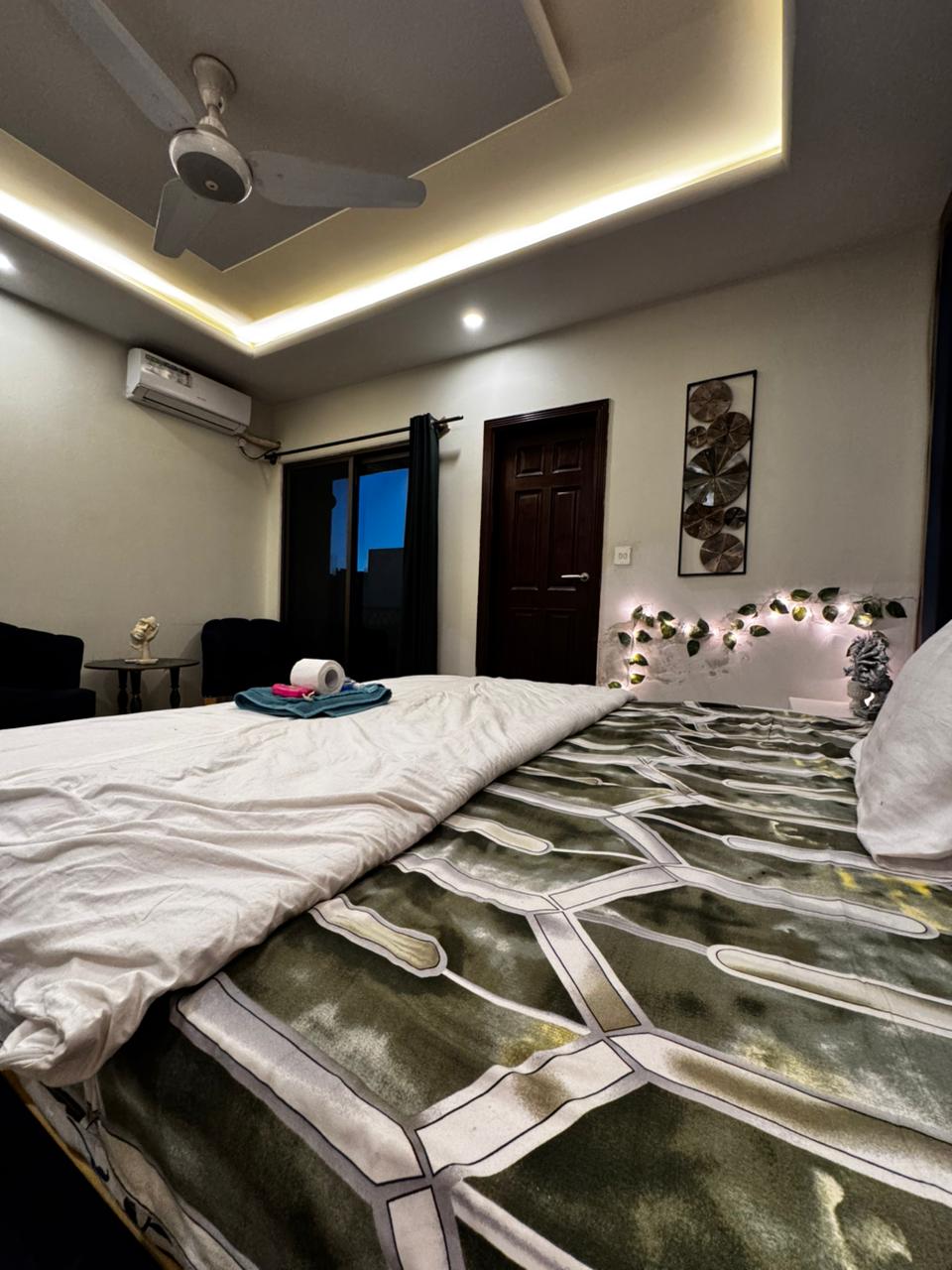 Sliding balcony door and air conditioning in the main bedroom of the Aangan three-bedroom apartment in E-11, Islamabad
