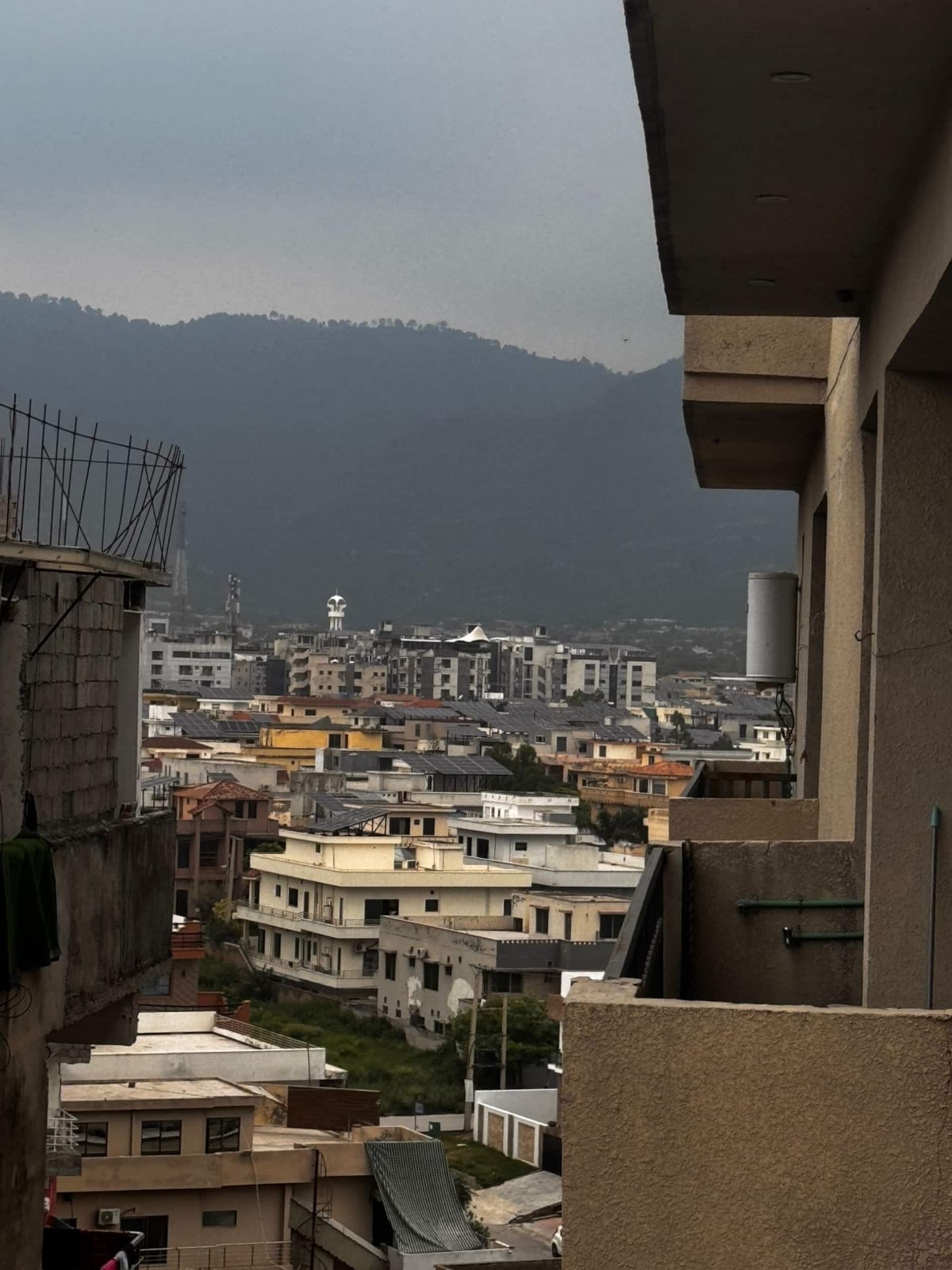 View over Islamabad towards the hills from the balcony of the Aangan three-bedroom gaming suite in Apollo Tower, E-11 Islamabad