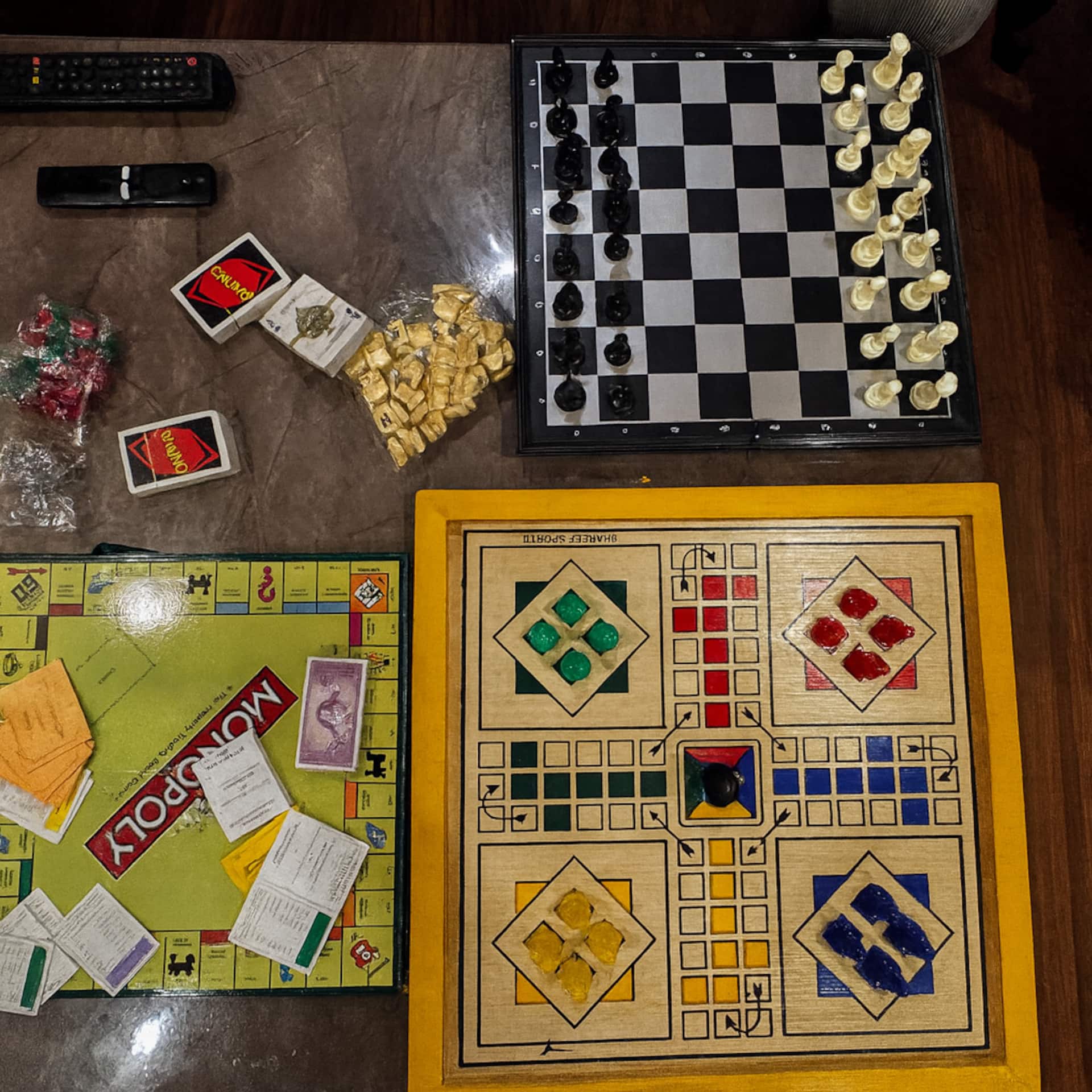 Board games including chess, Ludo, Monopoly and cards laid out at the Aangan three-bedroom gaming suite in Apollo Tower, E-11 Islamabad