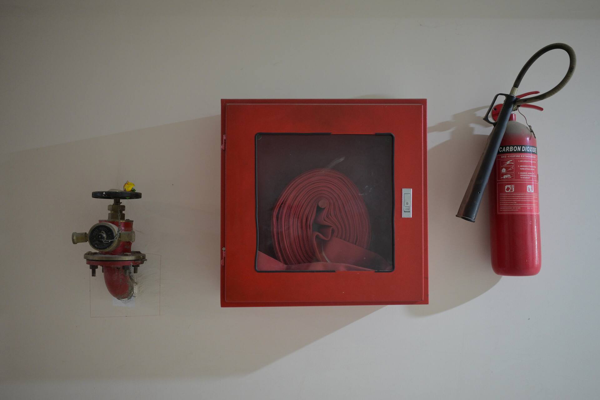 Fire hose reel and extinguisher in the corridor of Apollo Tower, E-11 Islamabad