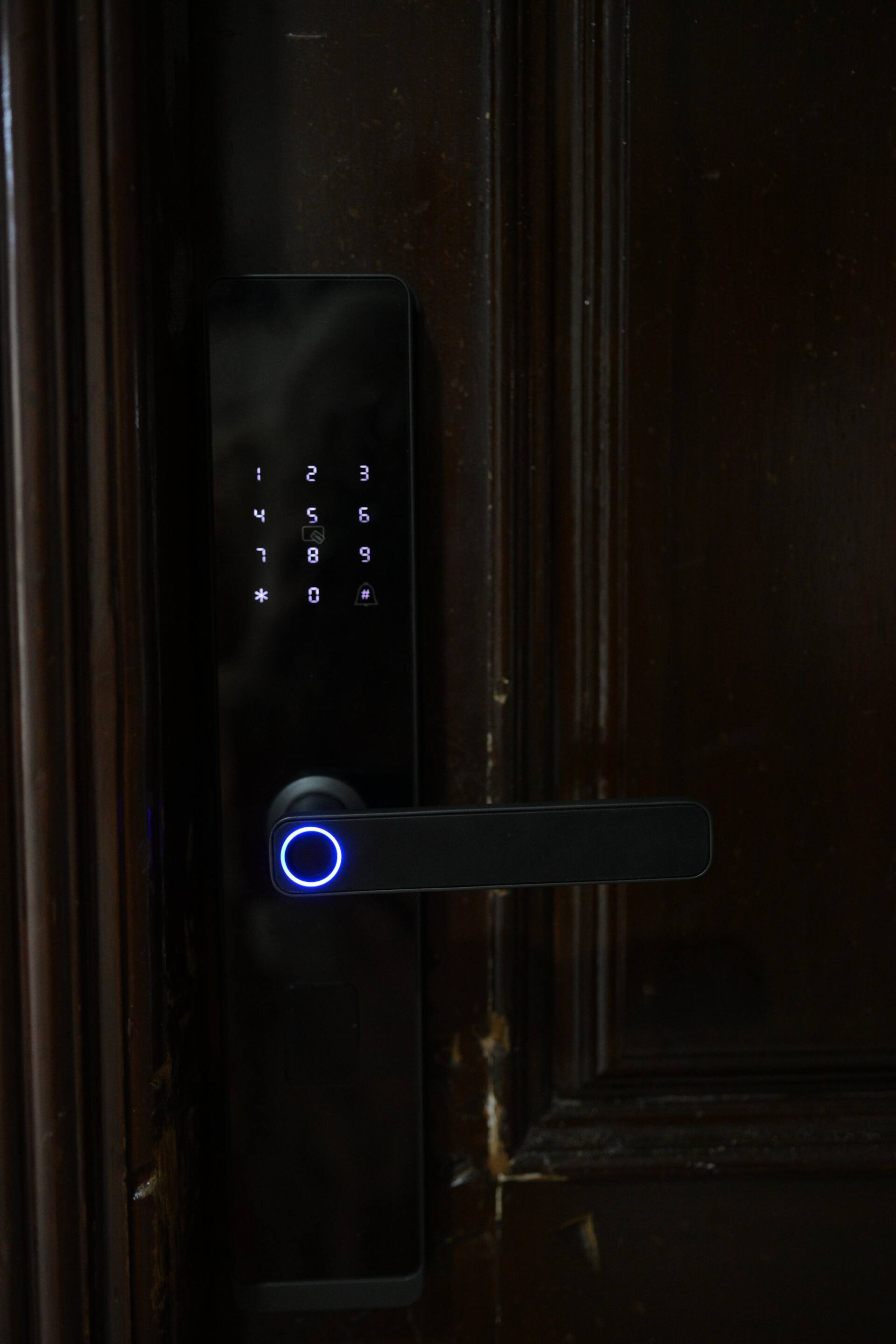 Keypad smart lock on the front door for self check-in at the Aangan three-bedroom gaming suite in Apollo Tower, E-11 Islamabad