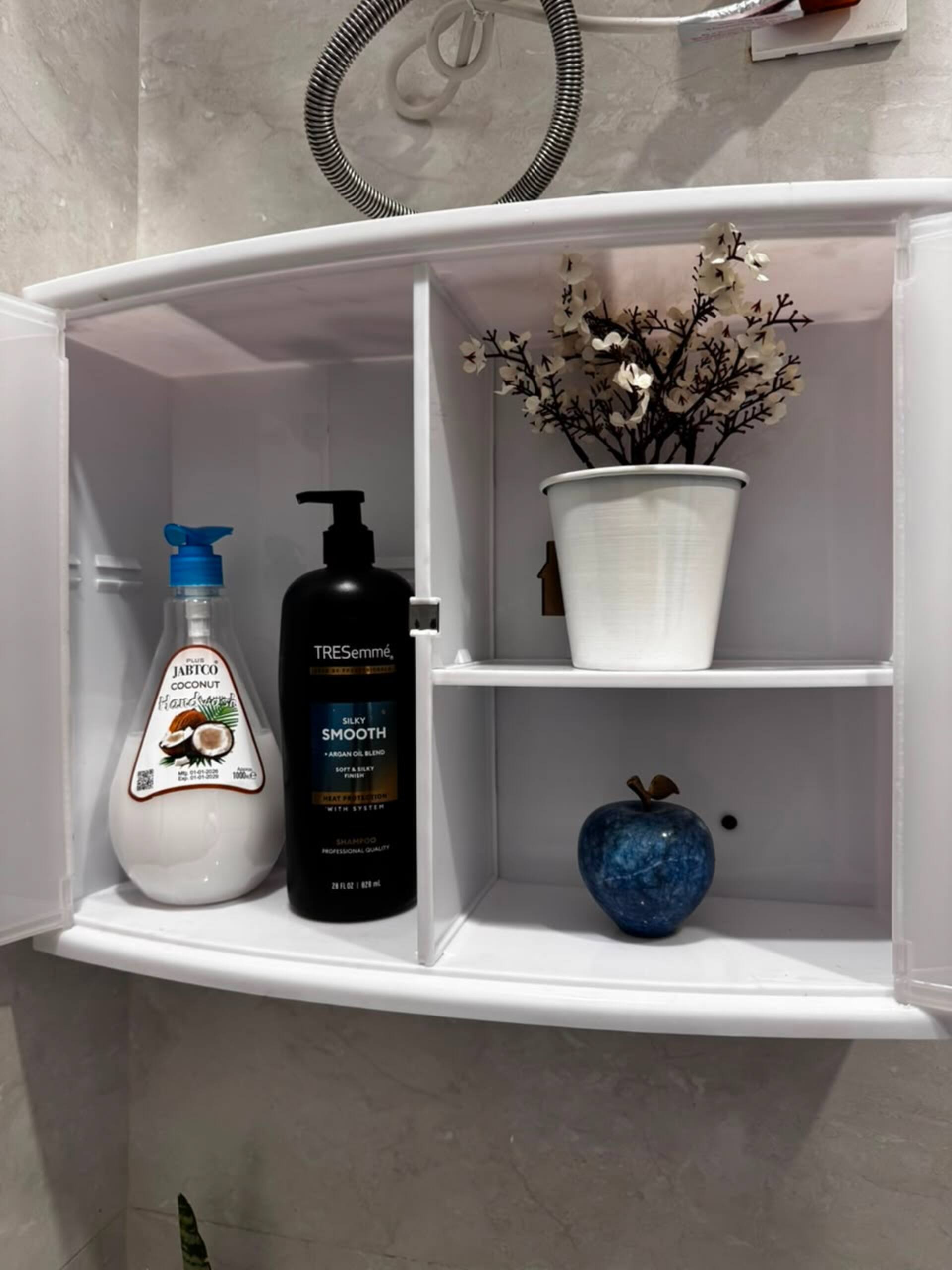 Shampoo and body wash provided in the bathroom of the Aangan studio apartment near Islamabad International Airport