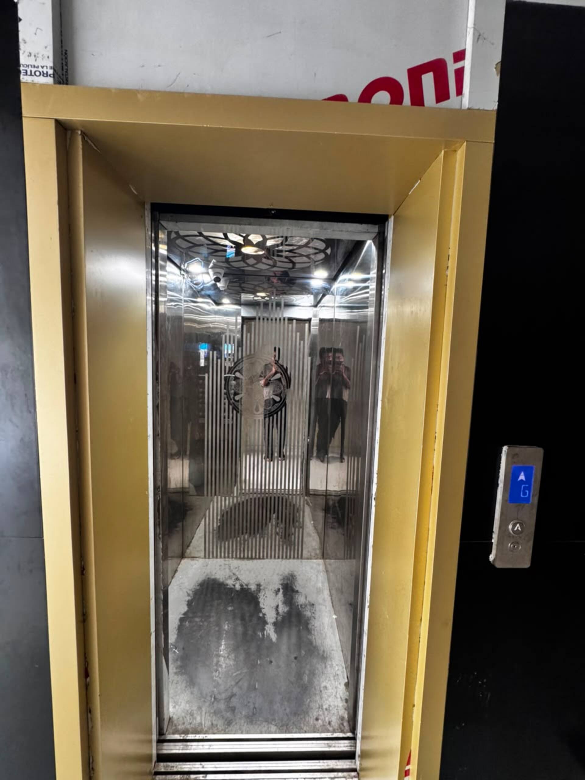 Lift inside the building of the Aangan studio apartment near Islamabad International Airport