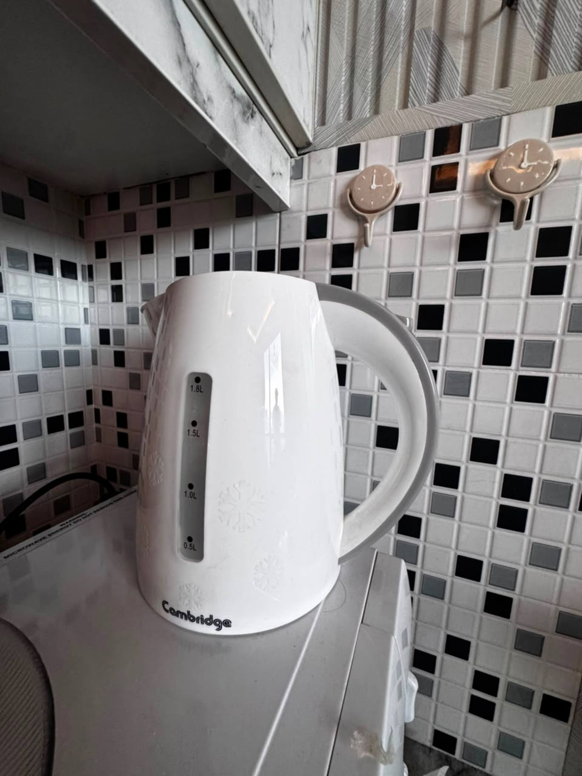 Electric kettle in the kitchenette of the Aangan studio apartment near Islamabad International Airport