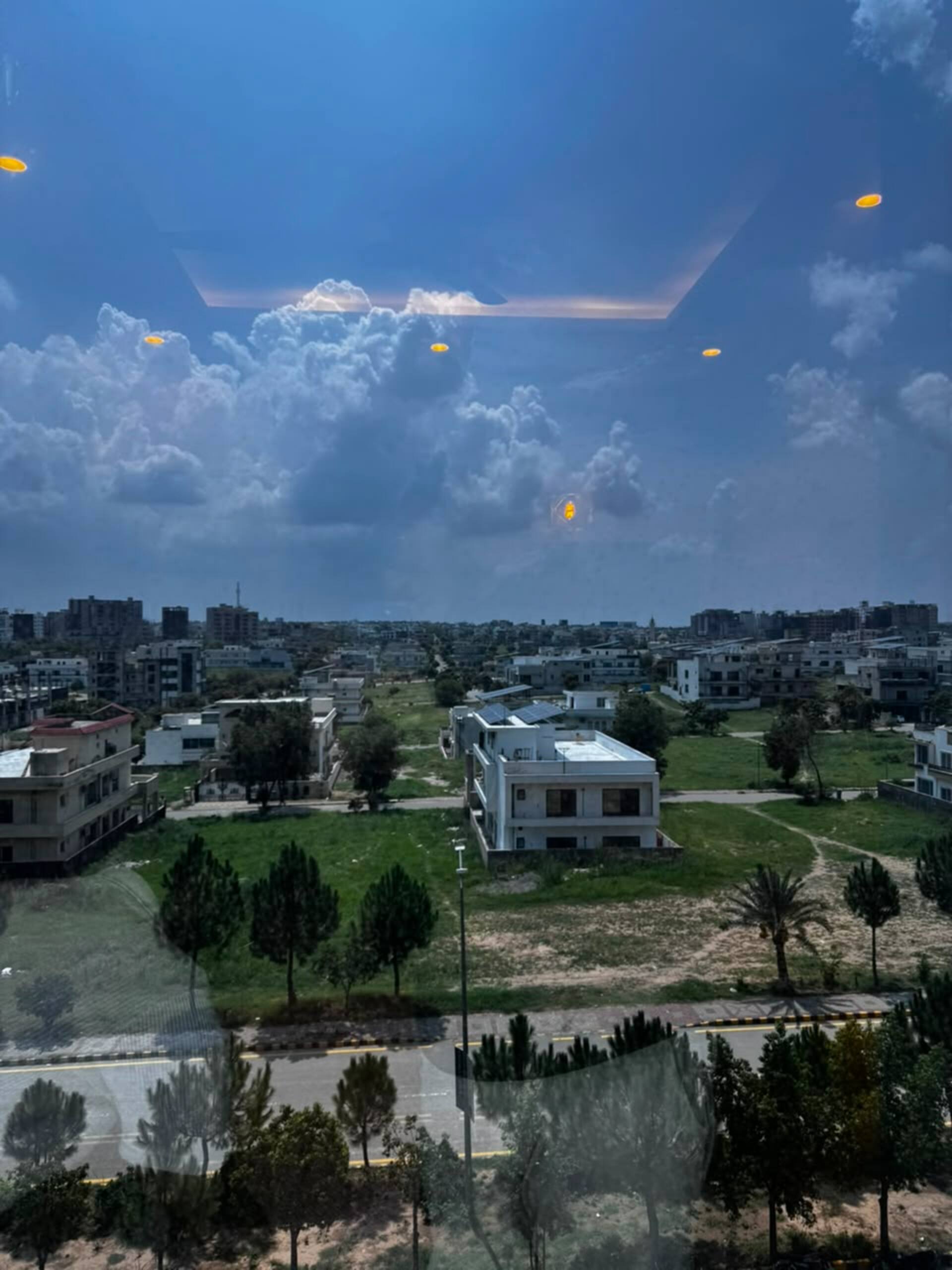 View over the surrounding neighbourhood from the window of the Aangan studio apartment near Islamabad International Airport