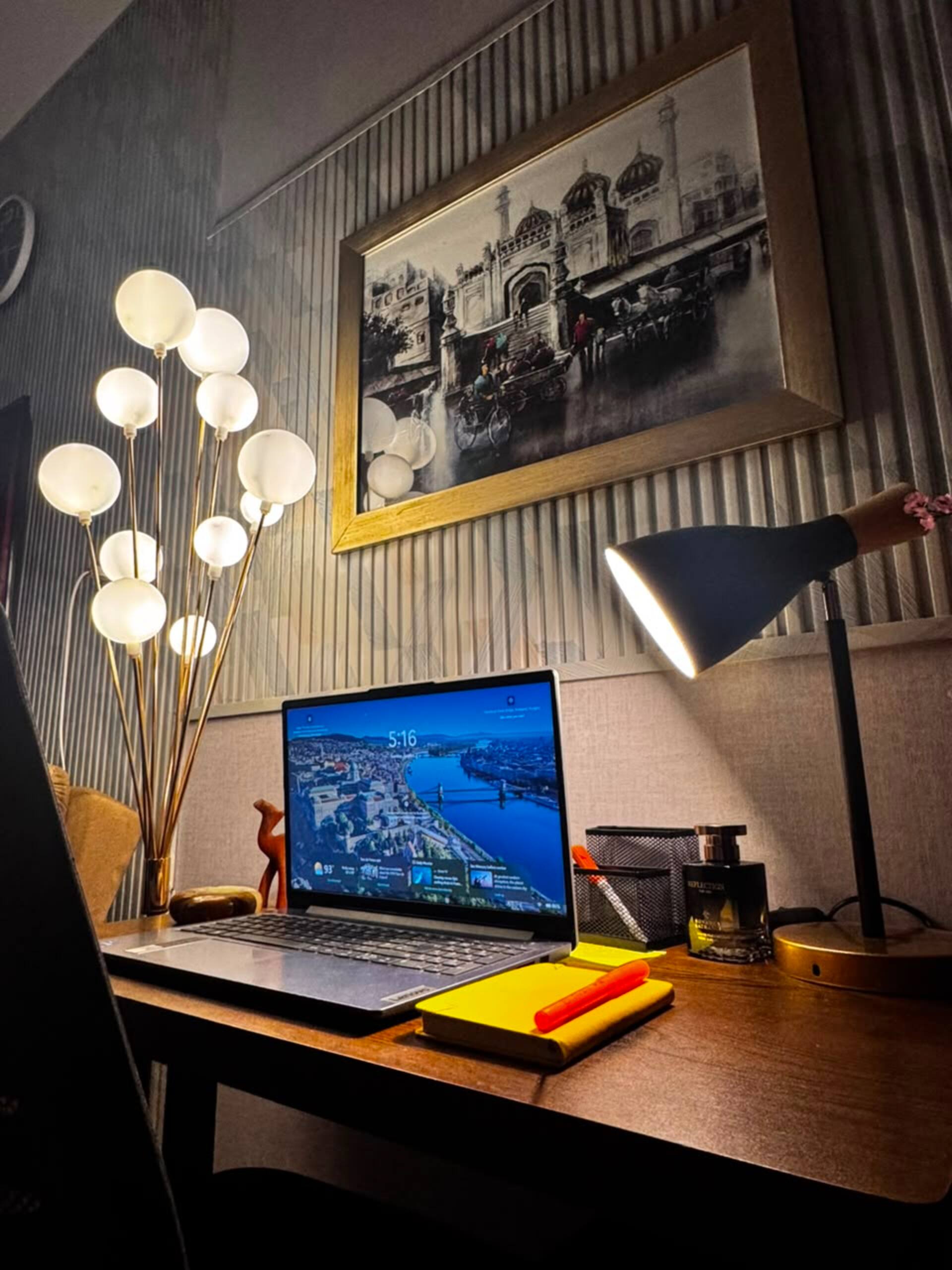 Dedicated workspace with a desk, chair and lamp in the Aangan studio apartment near Islamabad International Airport