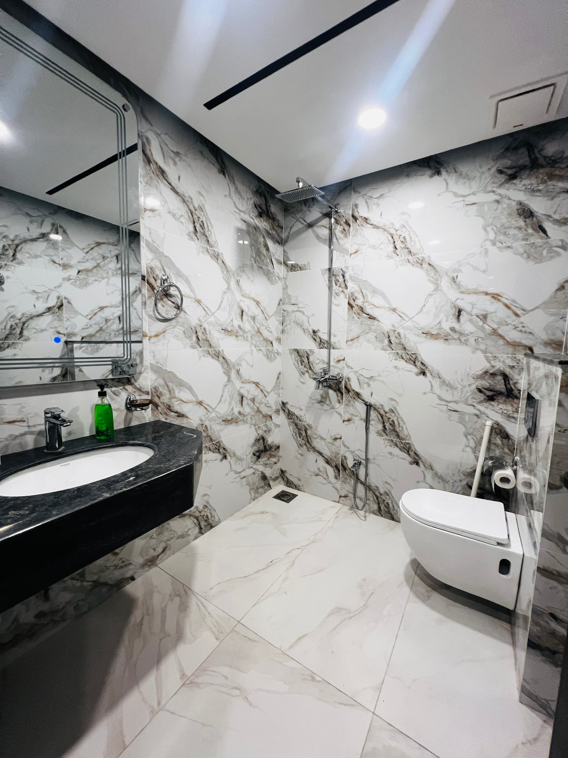 Bathroom with a washbasin and shower in the 3-bedroom Aangan apartment in Zeta Mall, Islamabad