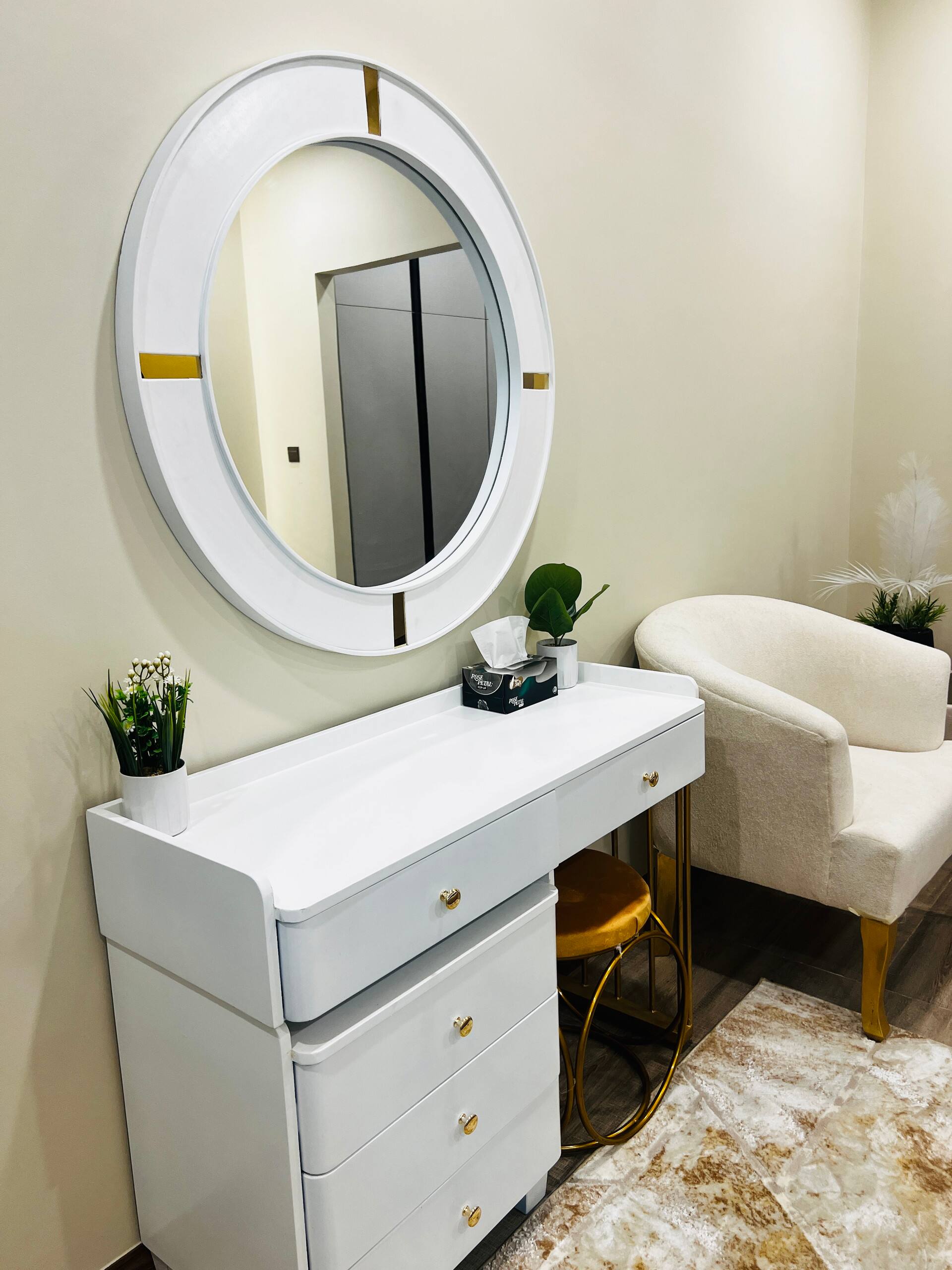 Dressing table with a round mirror in a bedroom of the 3-bedroom Aangan apartment in Zeta Mall, Islamabad