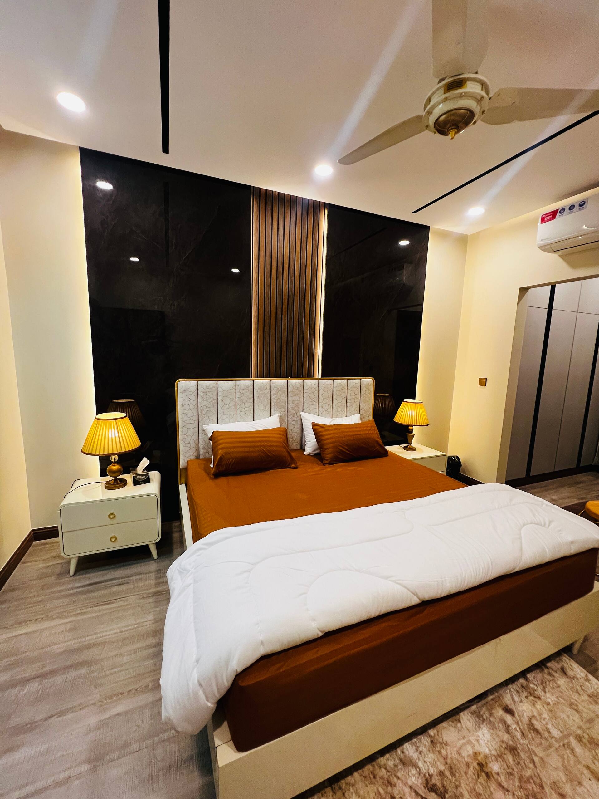 Wide view of the second bedroom in the 3-bedroom Aangan apartment in Zeta Mall, Islamabad