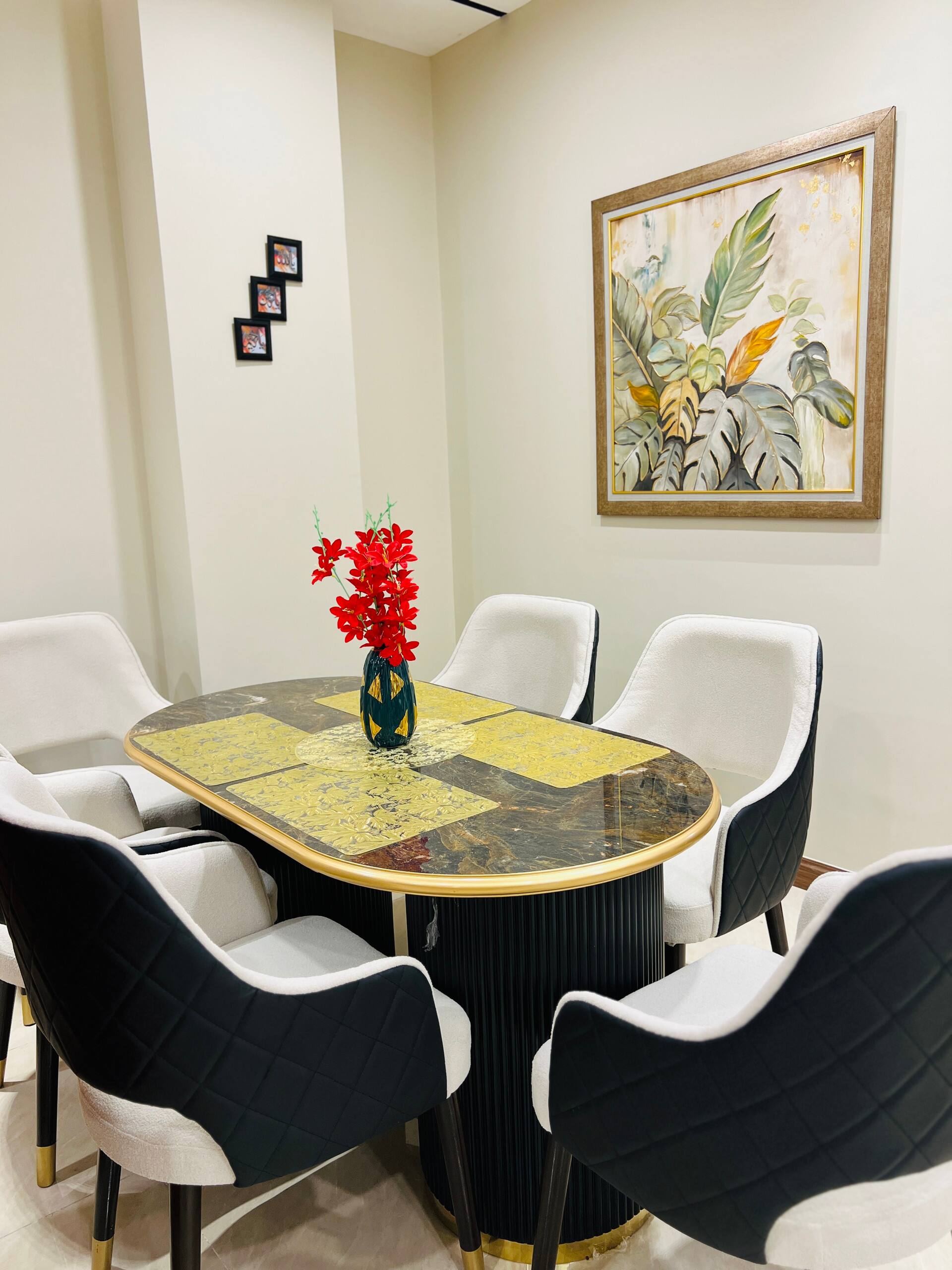 Dining table set with upholstered chairs in the 3-bedroom Aangan apartment in Zeta Mall, Islamabad