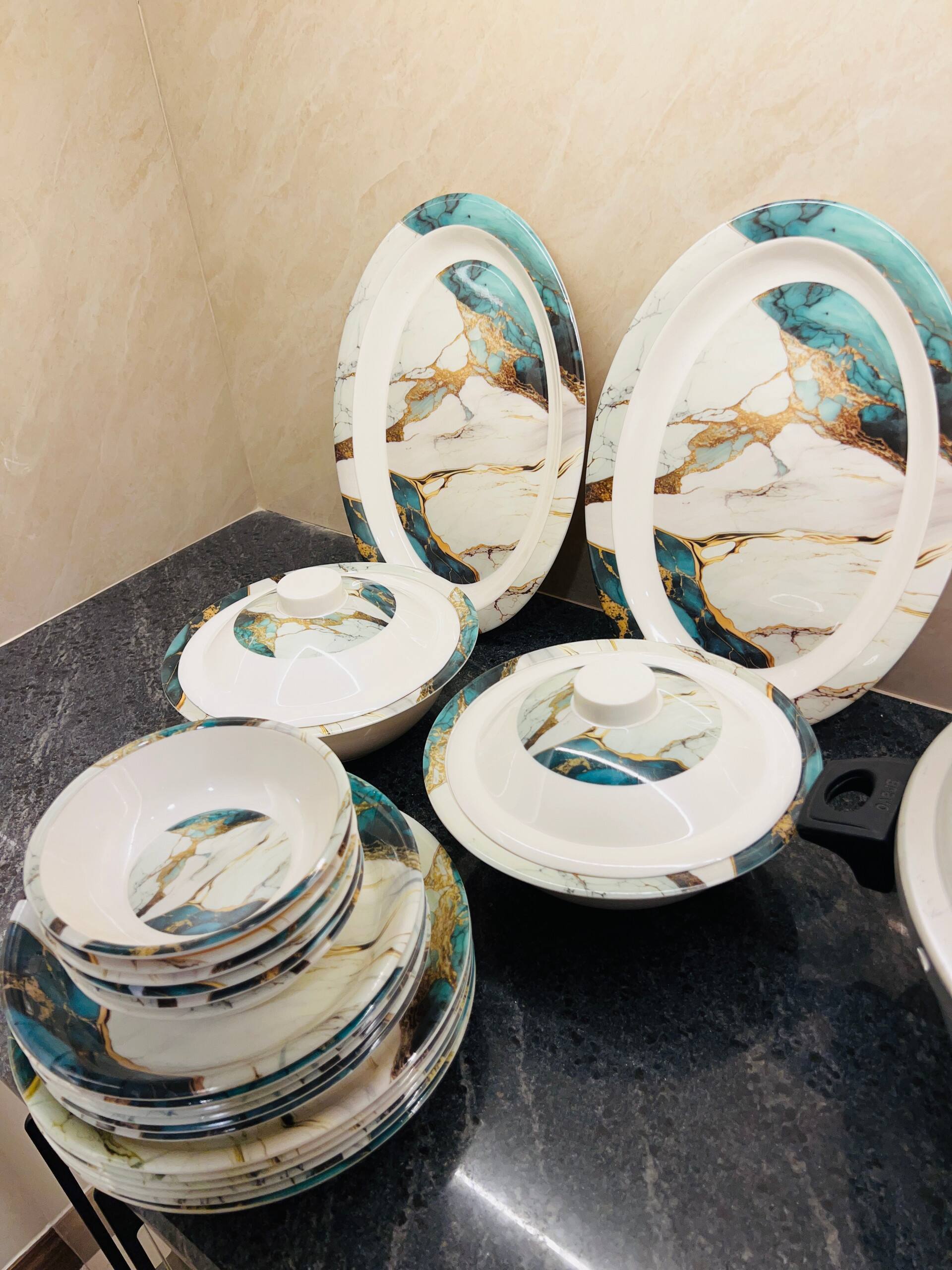 Crockery and dishes provided in the kitchen of the 3-bedroom Aangan apartment in Zeta Mall, Islamabad